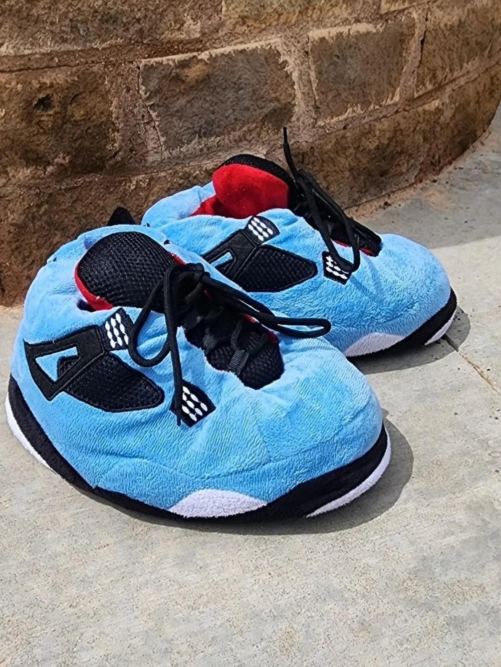 Air Jordan 4s Kids Light Blue Plush Lace-Up Sneakers with Black Accents